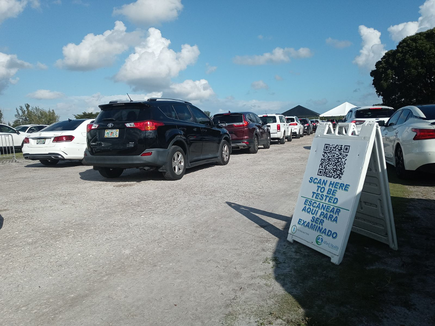 Cars idled for a full block outside the entrance of the drive-thru COVID-19 testing site at Amelia Earhart Park in Hialeah on December 20. - PHOTO BY JOSHUA CEBALLOS