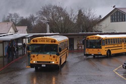 PHOTO BY SEAN KEARNS - A SCHOOL BUS DROPS OFF STUDENTS AT REDWAY ELEMENTARY SCHOOL.