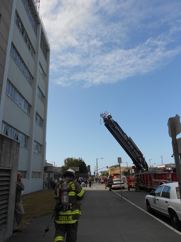A Humboldt Bay Fire ladder truck extends toward the courthouse roof. - LINDA STANSBERRY