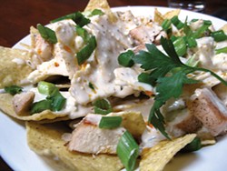 PHOTO BY JENNIFER FUMIKO CAHILL - Blue cheese nachos with chicken and chili oil at 3 Foods Café.
