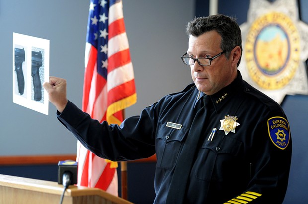 Eureka Police Chief Andy Mills holds up a side by side comparison of the hilt of a Walther PPQ replica and of real Walther PPQ during a press conference on the officer involved shooting death of McCain. Mills stated that following the shooting, officers recovered a replica Walther PPQ from McCain. - MARK MCKENNA