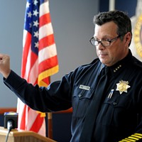 Eureka Police Chief Andy Mills holds up a side by side comparison of the hilt of a Walther PPQ replica and of real Walther PPQ during a press conference on the officer involved shooting death of McCain. Mills stated that following the shooting, officers recovered a replica Walther PPQ from McCain.