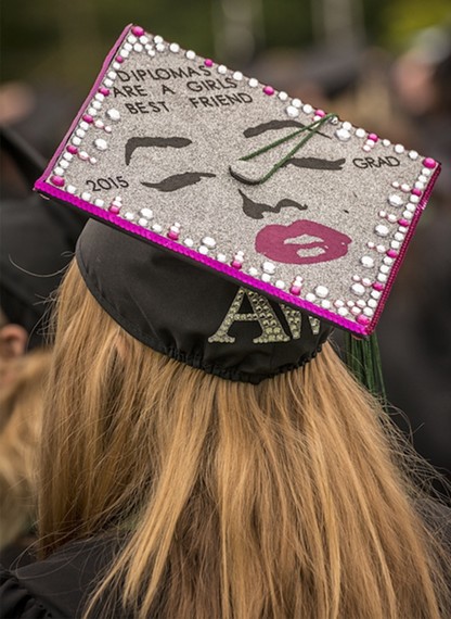 Dance major Amethyst Avra Weburg created my favorite inscription on her mortarboard hat: "Diplomas are a girls (sic) best friend." - MARK LARSON