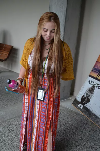 Joy Carrillo is from San Pedro and just starting liberal studies for elementary education. She's taking a liberal approach to Bohemian style in a yellow top and a brightly woven skirt. - PHOTO BY SHARON RUCHTE
