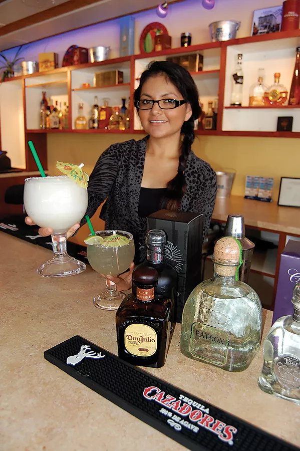 left Rita's margarita mistress Isamar Carrasco serves 'em strong. - PHOTO BY ANDREW GOFF