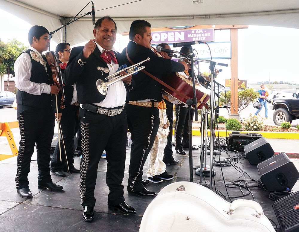 Mariachi Real de Mexico play real Mexican folkloric music to help celebrate the 20th anniversary of Wildberries Marketplace on Saturday, Aug. 16, in Arcata. - PHOTO BY BOB DORAN