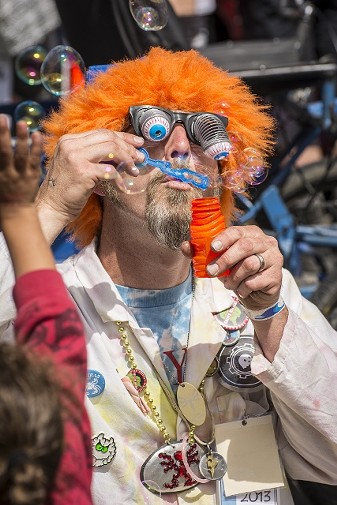Josh Nikolauson, of McKinleyville, a member of the Kinetic Paranormal Society and follower of the Travelling Magical Wardrobe, provides bubbles and laughs in Ferndale at the Kinetic Grand Championship 2014. - MARK LARSON