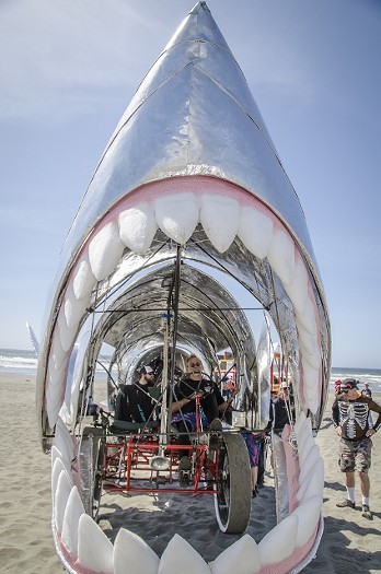 The great aluminum shark Bite Me's lead pilot Ken Bidelman takes a rest prior to the challenge of "June's Dunes" last year. - MARK LARSON