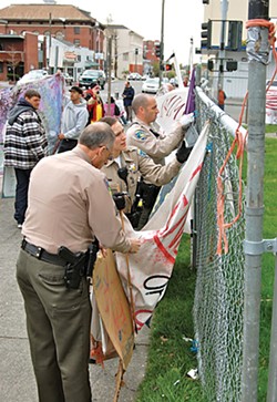 PHOTOS BY ANDREW GOFF - Occupy protester Patricia Kanzler being arrested by sheriff’s deputies in march.