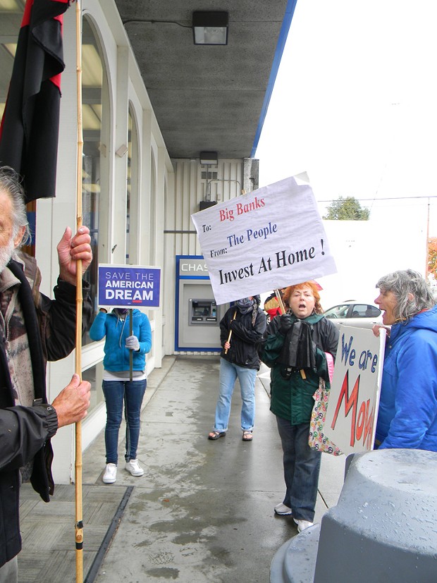 Protesters chant outside Chase in Eureka on Saturday. - PHOTO BY CARRIE PEYTON DAHLBERG