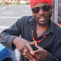 Rastafarian singer Winston van Ewijk, aka Winstrong, from Surinam, prepares for his set at Something for Everyone, C Baker&#39;s Showcase at the Jambalaya Friday night, Aug. 8.