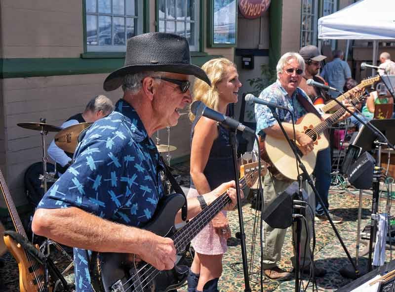 The country rock band Firesign plays in front OF the Arcata Playhouse for the monthly Creamery District Art Market on the last Saturday of the month, July 26. - PHOTO BY BOB DORAN.