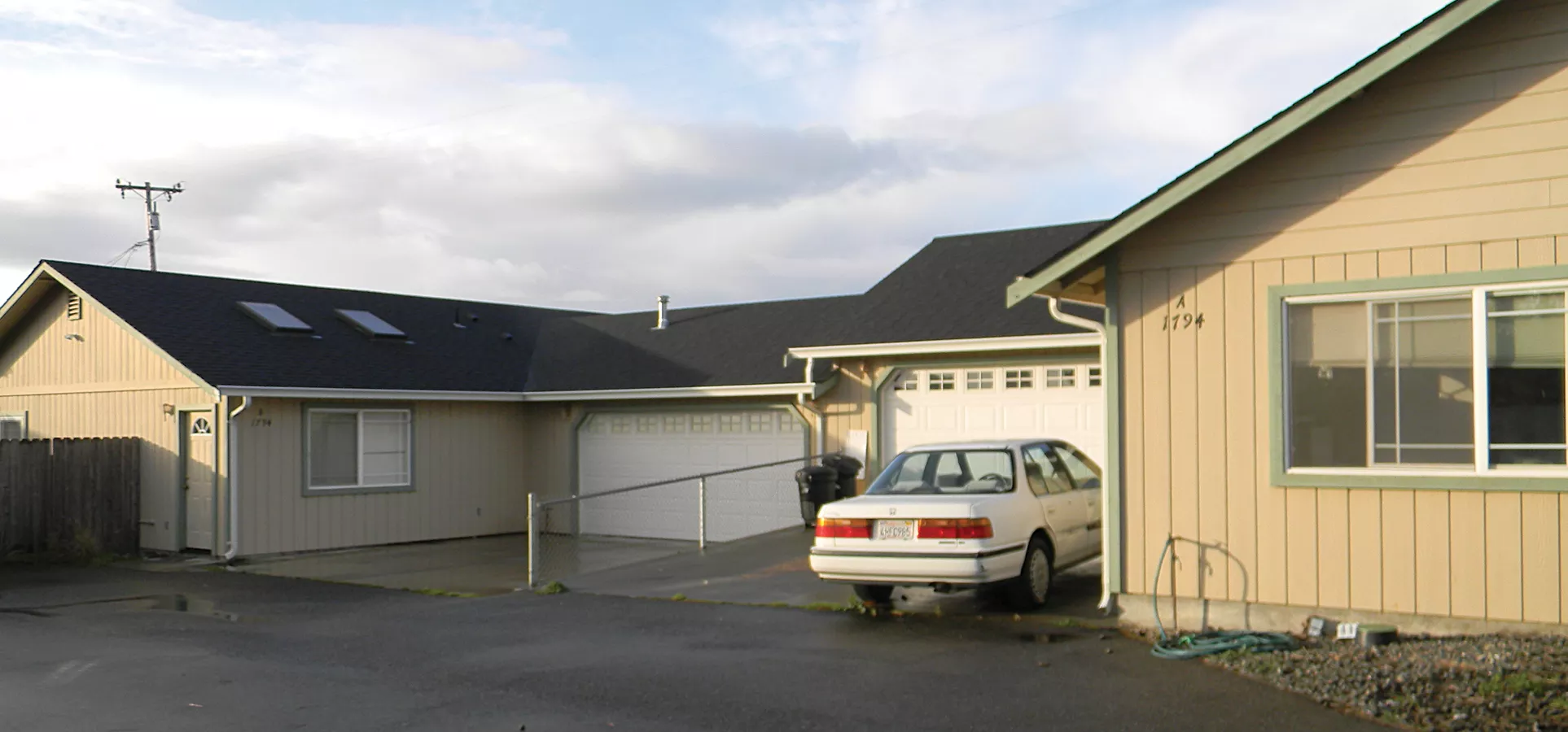 These two units, joined by a garage wall, became the site of discord after the family in front complained that the occupants in back were running a marijuana grow. The opaqued garage windows on the back unit were one of the first clues, the neighbors said - PHOTO BY CARRIE PEYTON DAHLBERG
