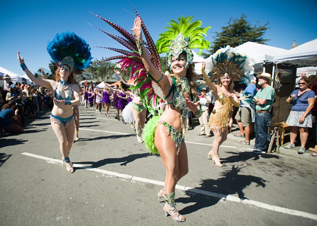 Samba dancers shook a tail feather near the end of the parade. - PHOTO BY MARK MCKENNA