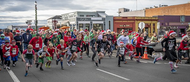 And they're off! The third annual Ugly Holiday Sweater Run. - PHOTO BY MARK LARSON