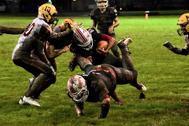 A rain-soaked Eureka Logger crowd at Albee Stadium celebrated a mud splattered victory Saturday night over previously unbeaten Las Lomas, 21-0, in the semifinal round of the North Coast Section D-III playoffs. - JOSE QUEZADA