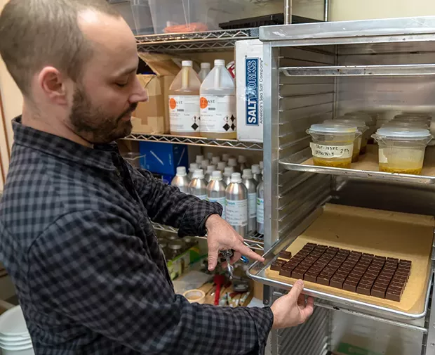 Jonah Ginsberg in the Humboldt Chocolate Bites kitchen. - PHOTO BY ZACH LATHOURIS