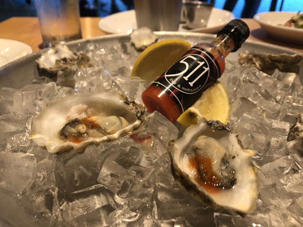 Oysters and housemade hot sauce. - PHOTO BY JENNIFER FUMIKO CAHILL
