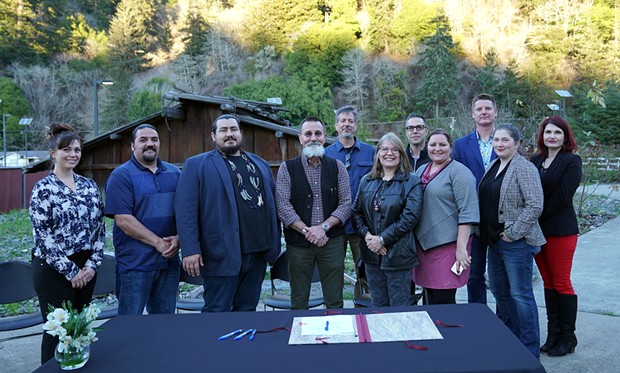 In a Feb. 12 photo, representatives from the Yurok Tribe and California Department of Parks and Rec sign a landmark agreement for the Tribe to operate the Stone Lagoon Visitor Center. - COURTESY OF THE YUROK TRIBE