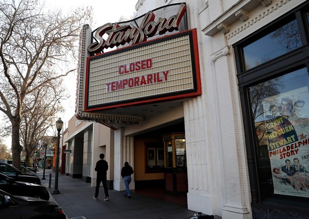 A sign outside of the Stanford Theatre announced its temporary closure in downtown Palo Alto on March 4, 2020. - PHOTO BY NHAT V. MEYER, BAY AREA NEWS GROUP