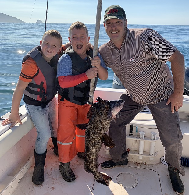 Riley Schneider, center, along with brother Parker and dad Travis, were all smiles after Riley landed his first-ever lingcod on his own while fishing near Cape Mendocino last Thursday. - PHOTO COURTESY OF TIM PETRUSHA