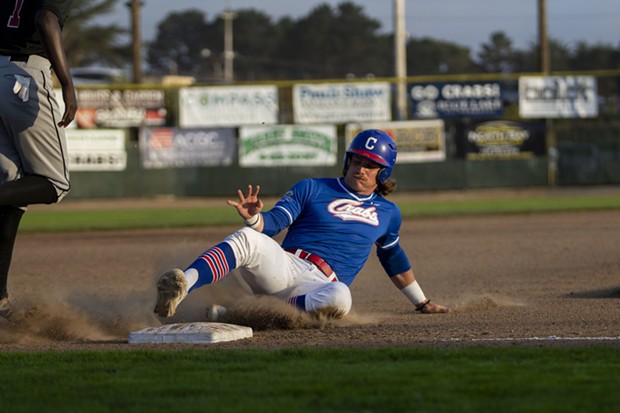 Crabs outfielder Josh Lauck slides into third base against the NorCal Warriors on June 29, 2021. - THOMAS LAL