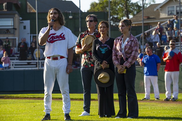 Crabs outfielder Tyler Ganus sings the national anthem with his family on the field with him ahead of the Crabs' game against the Prescott Roadrunners on July 28, 2021. - THOMAS LAL