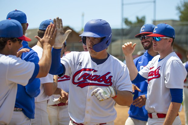 Crabs outfielder Aidan Morris is congratulated by teammates after hitting the team's 41st home run of the season, breaking the single season wood bat record for the team as a whole on August 1, 2021 at Arcata Ballpark. - THOMAS LAL