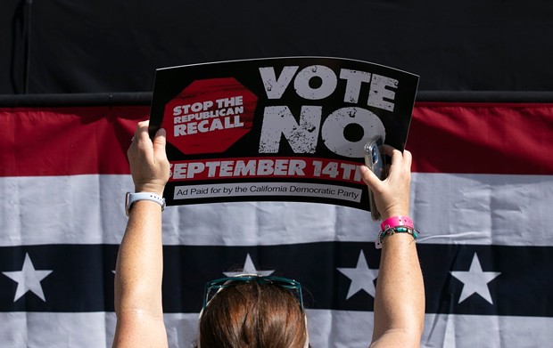 A Gavin Newsom supporter holds up a sign against the recall election at a campaign event at the IBEW-NECA training center in San Leandro on Sept. 8, 2021. - PHOTO BY ANNE WERNIKOFF, CALMATTERS