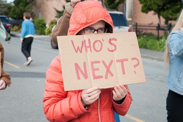 Sunny Brae Middle School student Nova Vaur held a sign asking, "Who's next?" at Saturday's March For Our Lives in Arcata. - PHOTO BY MARK MCKENNA