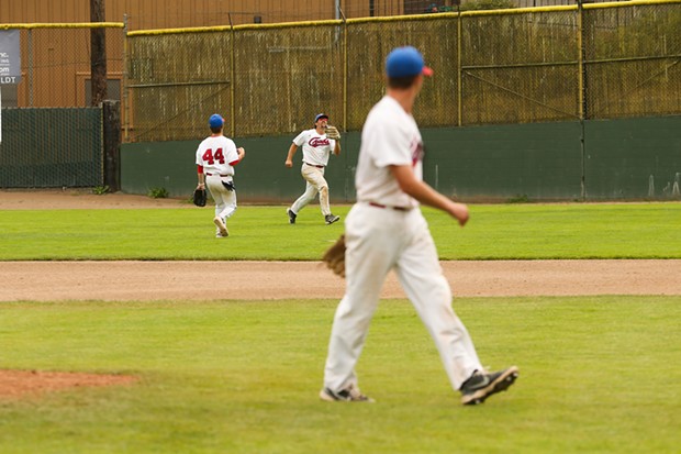 Crabs pitcher Caleb Ruiz walks toward home plate while checking over his shoulder as outfielder Cary Arbolida makes the final out of a 2-0 complete game shutout against the West Coast Kings on July 17. - THOMAS LAL