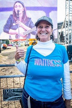 Jan Schmidt, of Eureka, and a big fan of Sara Bareilles (live on the video screen behind her), said she'd seen Waitress on a Broadway stage in New York City. - PHOTO BY MARK A. LARSON