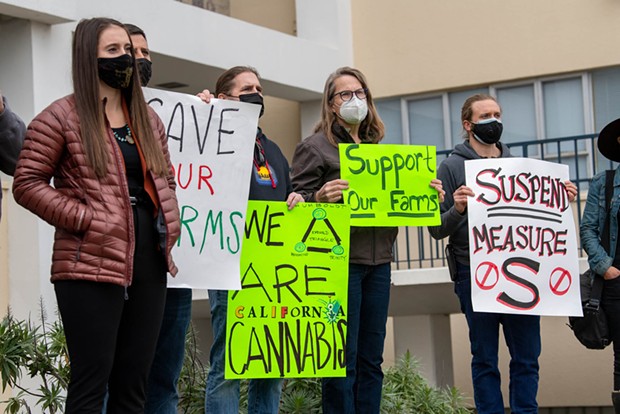 Members of the cannabis industry, complaining of over regulation, high compliance costs and heavy tax burdens, protest the county's Measure S tax in January of 2022. - FILE PHOTO