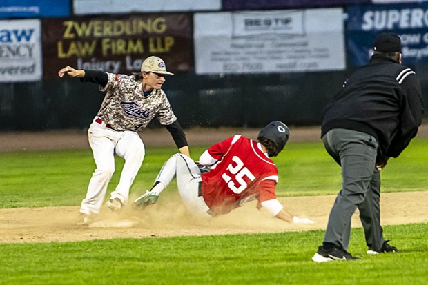 Crabs shortstop Luke Reece makes the tag at second base on a sliding Novato Knicks runner. Reece went one-for-three in a close 2-0 loss in the second game of the 2023 Crabs season. - PHOTO BY JOSE QUEZADA