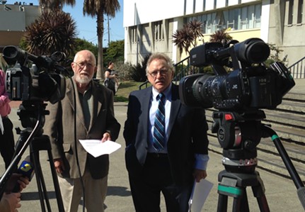 Leo Sears (left) stands with his attorney, Bill Bertain, while announcing the filing of his conflict of interest lawsuit against the Humboldt County Harbor, Conservation and Recreation District this afternoon. - THADEUS GREENSON