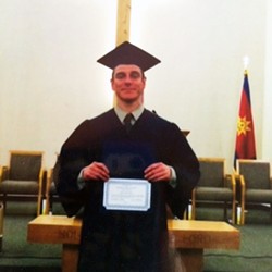 Jason Dale Johnson receiving his high school diploma last spring. - SUBMITTED