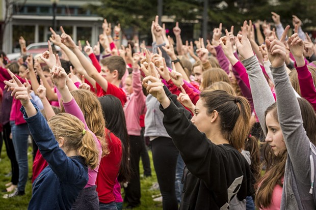 Hands go up on the Arcata Plaza at One Billion Rising. - MARK LARSON