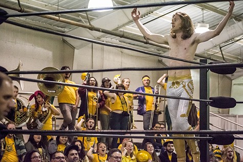 Brett Walters (aka Rocket Boy Brett) paused during his tag-team match to soak in support from his fellow HSU students and friends and The Marching Lumberjacks band. - MARK LARSON