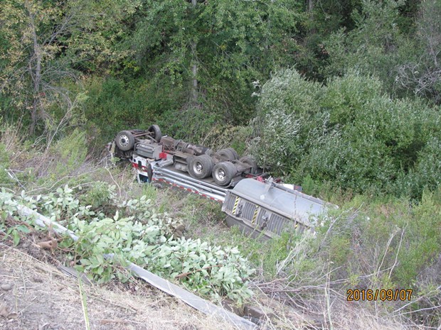 Caltrans reported the overturned truck's tanks were intact with minimal leaking observed on Thursday. - FACEBOOK