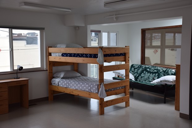 A bunk bed sits in the newly remodeled family shelter, which is decorated with donated art and furniture. - THADEUS GREENSON
