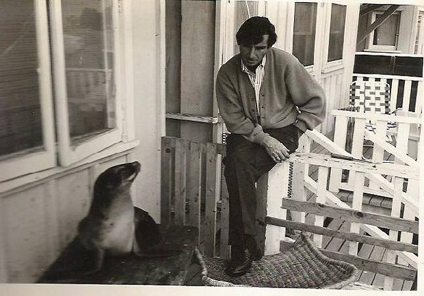 Glenn Miller sitting with Suzie the seal he rescued and nursed back to full health. - SUBMITTED