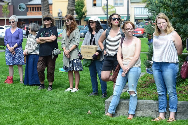 Around 60 people gathered at the Arcata Plaza's Southeast corner on Sunday for a vigil to stand in solidarity with Charlottesville, Virginia, following a deadly car attack on protesters Saturday. - MARK MCKENNA