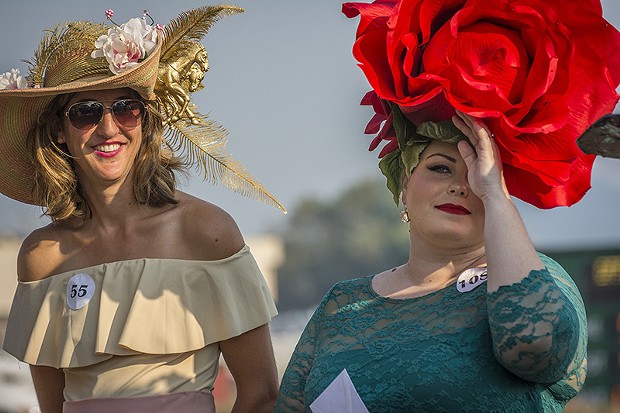Heather Bellinger and Paulette Hanson looking blooming lovely on Ladies Hat Day. - PHOTO BY MARK LARSON