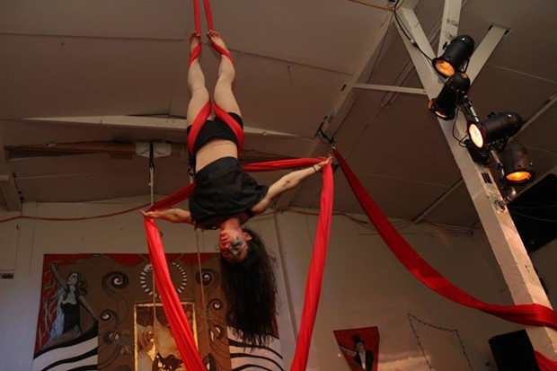 An aerialist performing at the soon-to-be-vacated Synapsis Studio. - COURTESY OF LESLIE CASTELLANO