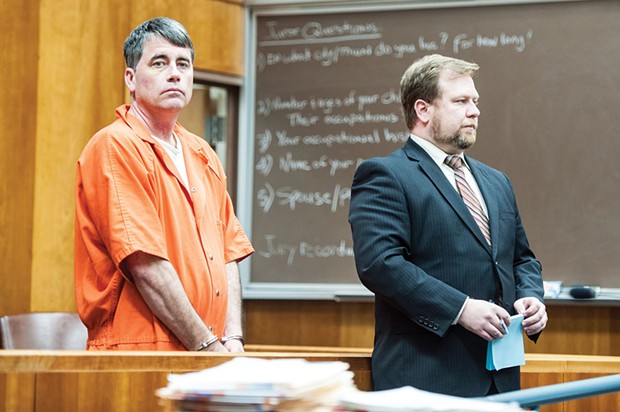 Gary Lee Bullock stands next to his attorney, Kaleb Cockrum, at his arraignment in January of 2014. - PHOTO BY MARK MCKENNA