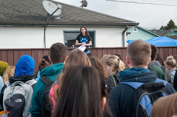 Fortuna High School senior and walkout organizer Brigette Faulk addresses about 150 students across the street from campus. - MARK MCKENNA