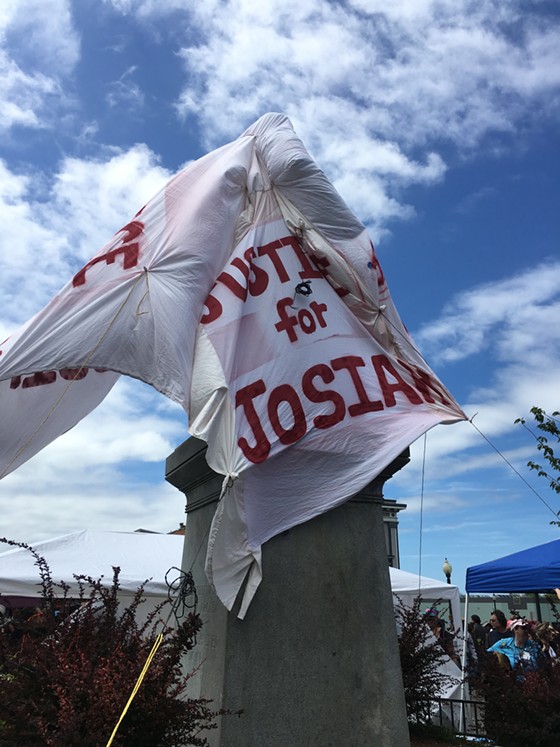 The McKinley statue was shrouded in a "Justice for Josiah" banner for today's kick off of the Kinetic Grand Championship race. - THADEUS GREENSON