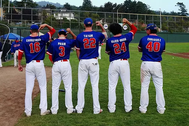 Crabs players show off their Blue uniforms. Home-run champ of the series, #40 Ramon Enriquez far right. - MATT FILAR
