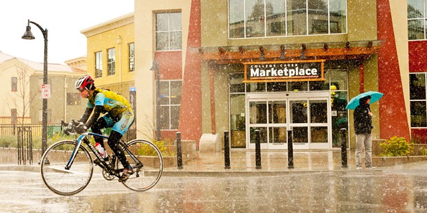 A cyclist braves the downpour on the trip through Humboldt State University’s campus.