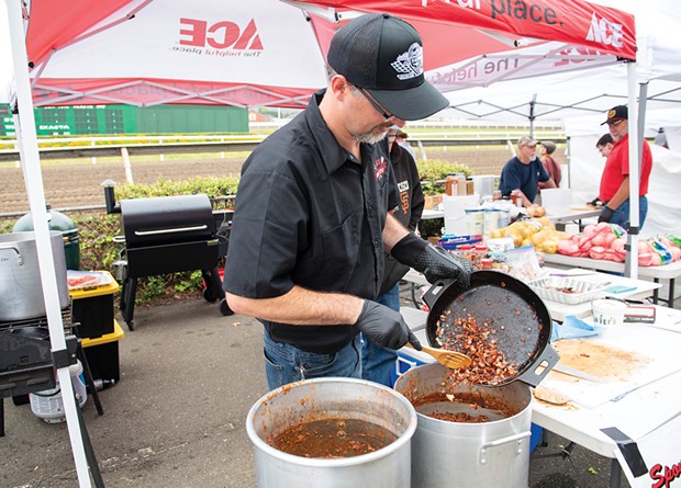 Tim Jones cooks up chili as the one-man Shafer's Ace Hardware team.